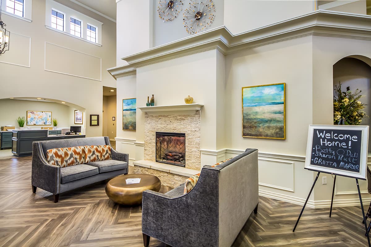 senior living community lobby with fireplace