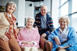 group of seniors in sweaters enjoying Senior Respite Care Homes in garland tx