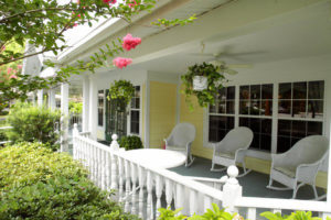 yellow porch as one of many senior living community amenities