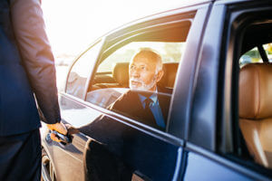 senior man in the car of Senior Living Transportation Services